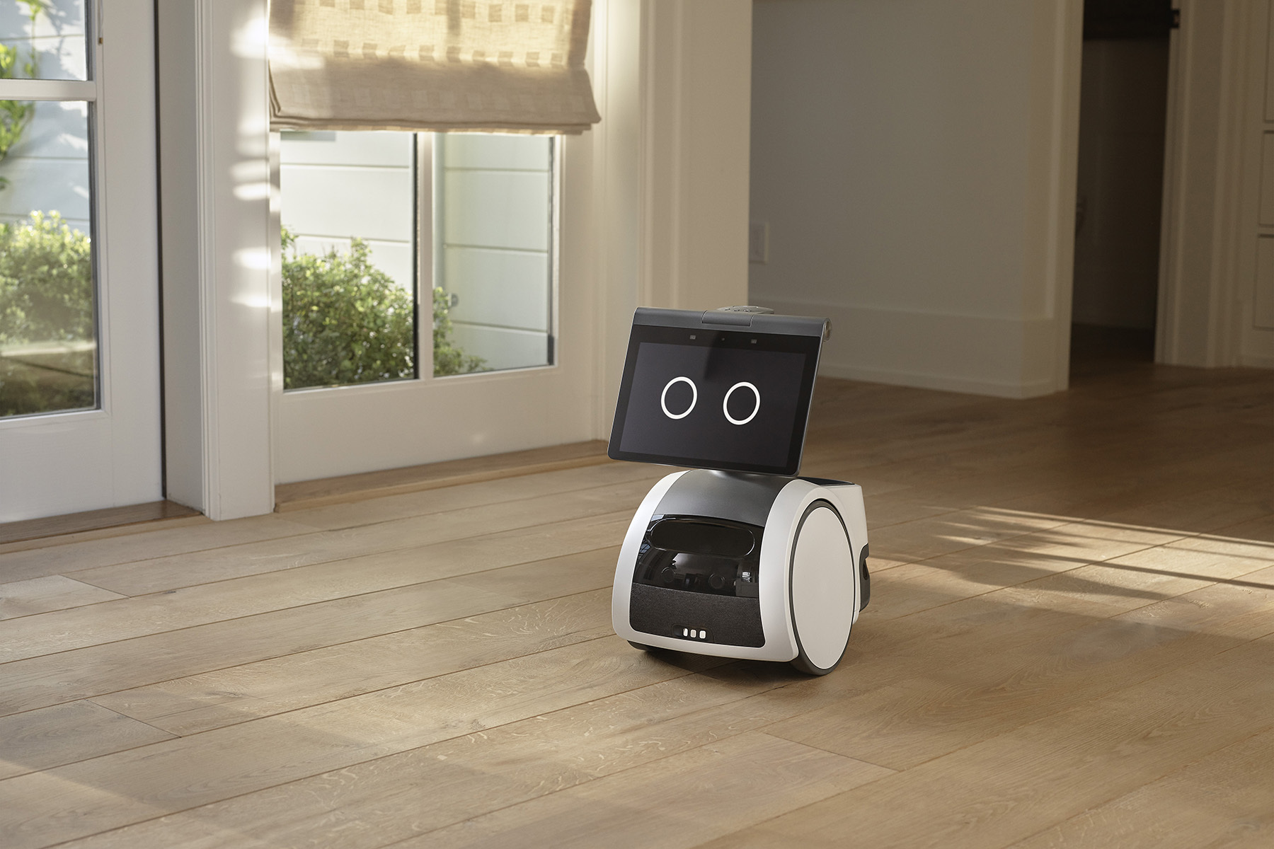 A home robot on a wooden floor