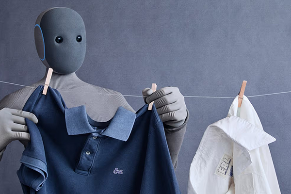 A NOI humanoid robot hanging laundry